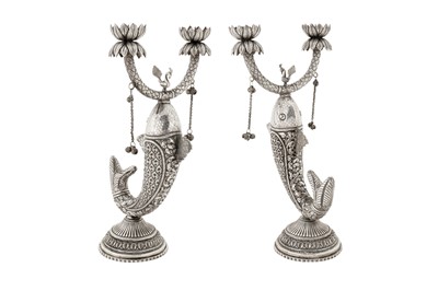Lot 89 - A pair of mid-20th century Indian unmarked silver candlesticks, probably Delhi circa 1960