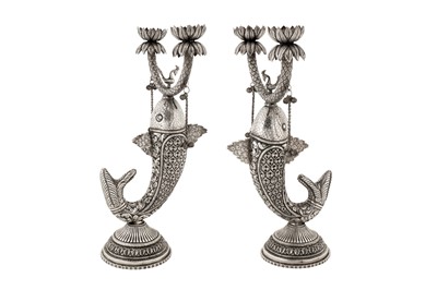 Lot 89 - A pair of mid-20th century Indian unmarked silver candlesticks, probably Delhi circa 1960
