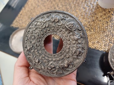 Lot 189 - A TIBETAN SILVER 'EIGHT AUSPICIOUS SYMBOLS' GAU TOGETHER WITH A SILVER AND COPPER 'EIGHT AUSPICIOUS SYMBOLS' GAU