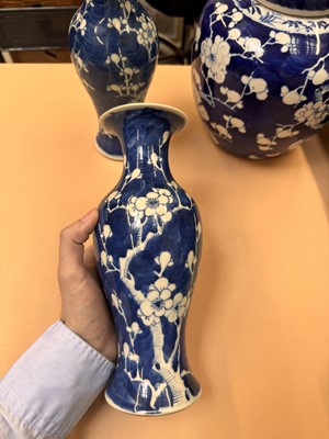 Lot 467 - A CHINESE BLUE AND WHITE 'PRUNUS' JAR AND TWO VASES