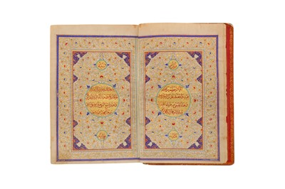 Lot 22 - AN IMPRESSIVE MID-19TH CENTURY PERSIAN ILLUMINATED QAJAR QUR’AN, DATED 1286AH (1869AD)