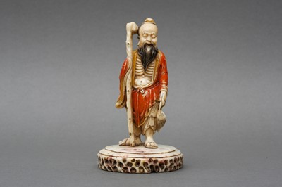 Lot 150 - A CHINESE SOAPSTONE FIGURE OF AN EMACIATED LUOHAN