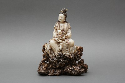 Lot 153 - A LARGE CHINESE SOAPSTONE FIGURE OF GUANYIN AND CHILD