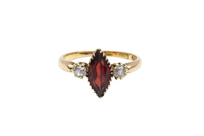 Lot 288 - A THREE-STONE GARNET AND DIAMOND RING