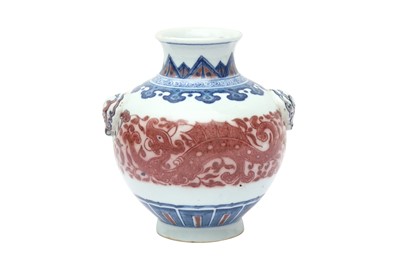 Lot 107 - A CHINESE BLUE AND WHITE AND COPPER-RED 'DRAGON' JAR