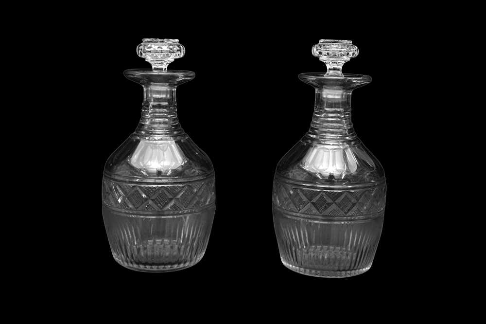Lot 43 - A PAIR OF GEORGE III CUT GLASS DECANTERS OF MALLET SHAPE, CIRCA 1800