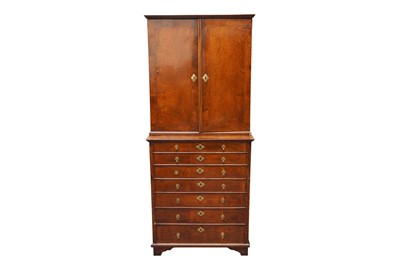 Lot 15 - A FEATHER BANDED WALNUT CABINET ON CHEST CIRCA 1920-1930