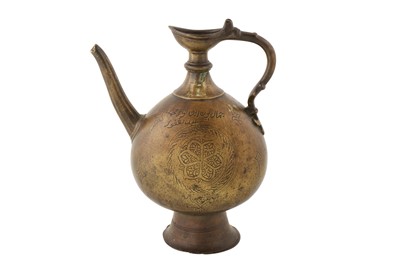 Lot 141 - A 16TH CENTURY MUGHAL BRASS EWER WITH HANDLE