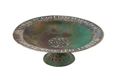 Lot 74 - A 12TH CENTURY PERSIAN SELJUK SILVER INLAID BRONZE FOOTED PLATE OR 'TAZA'