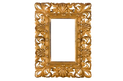 Lot 165 - A FLORENTINE 19TH CENTURY CARVED, PIERCED, SWEPT AND GILDED FRAME