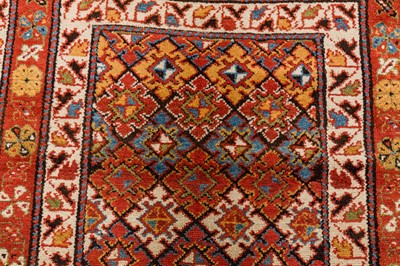 Lot 61 - AN ANTIQUE NORTH-WEST PERSIAN LONG RUG