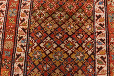 Lot 61 - AN ANTIQUE NORTH-WEST PERSIAN LONG RUG