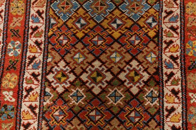 Lot 61 - AN ANTIQUE NORTH-WEST PERSIAN LONG RUG