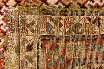 Lot 61 - AN ANTIQUE NORTH-WEST PERSIAN LONG RUG