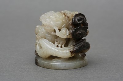 Lot 143 - A CHINESE GREY AND BLACK JADE 'DRAGON AND LINGZHI' CARVING