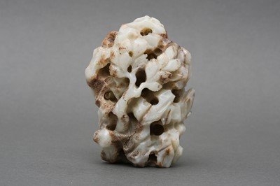 Lot 142 - A CHINESE CARVED 'DRAGON AMONG MOUNTAINS' JADE