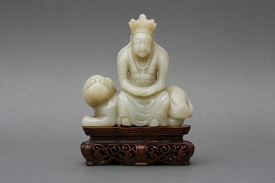 Lot 144 - A CHINESE CELADON JADE CARVING OF BUDDHA