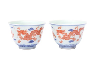 Lot 636 - A PAIR OF CHINESE BLUE AND WHITE AND IRON-RED 'DRAGON' CUPS