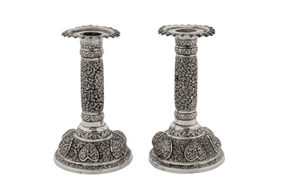 Lot 118 - A rare pair of early 20th century Anglo – Indian unmarked silver candlesticks, Lucknow circa 1910