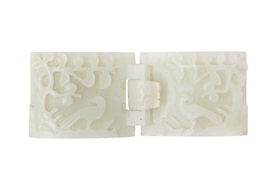 Lot 129 - A CHINESE PALE-CELADON JADE 'BIRD AND BLOSSOMS' BELT BUCKLE