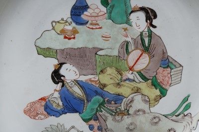 Lot 22 - A CHINESE FAMILLE-VERTE 'LADIES WITH FANS' DISH