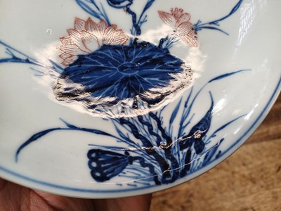 Lot 17 - A RARE CHINESE BLUE AND WHITE AND COPPER-RED 'LOTUS AND EGRET' DISH