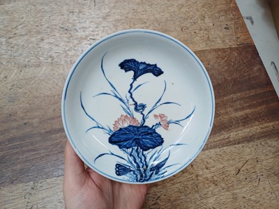 Lot 17 - A RARE CHINESE BLUE AND WHITE AND COPPER-RED 'LOTUS AND EGRET' DISH