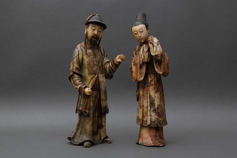 Lot 25 - TWO RARE AND IMPRESSIVE CHINESE SOAPSTONE STANDING COURT FIGURES