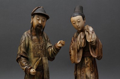 Lot 25 - TWO RARE AND IMPRESSIVE CHINESE SOAPSTONE STANDING COURT FIGURES