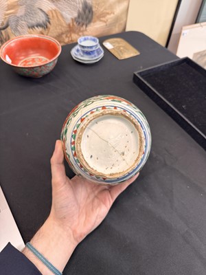 Lot 27 - A CHINESE WUCAI 'LOTUS AND LION DOG' JAR