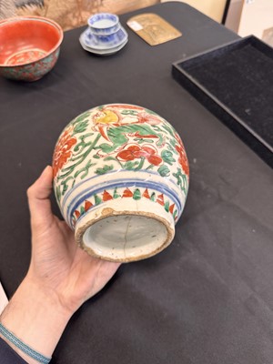 Lot 27 - A CHINESE WUCAI 'LOTUS AND LION DOG' JAR