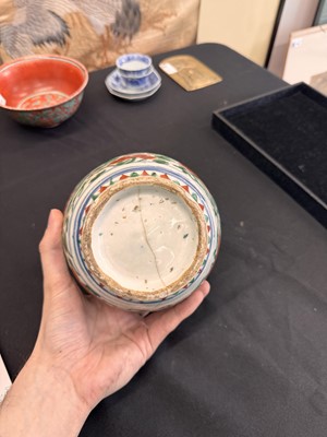 Lot 27 - A CHINESE WUCAI 'LOTUS AND LION DOG' JAR