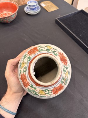 Lot 27 - A CHINESE WUCAI 'LOTUS AND LION DOG' JAR