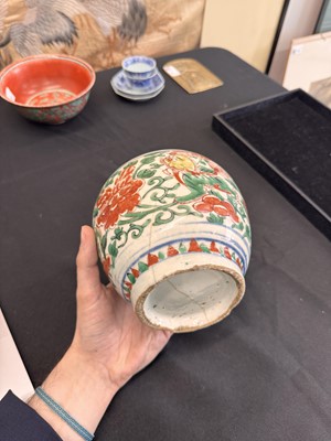 Lot 27 - A CHINESE WUCAI 'LOTUS AND LION DOG' JAR