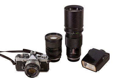 Lot 34 - An Olympus OM2 SLR Outfit