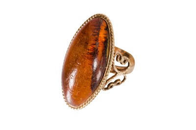 Lot 7 - AN AMBER RING