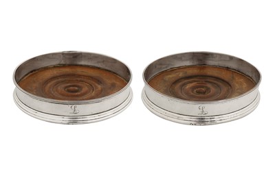 Lot 396 - A pair of George III sterling silver wine coasters, London 1787 possibly by Robert Hennell