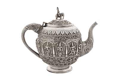 Lot 129 - A late 19th century Anglo – Indian unmarked silver teapot, Madras circa 1890