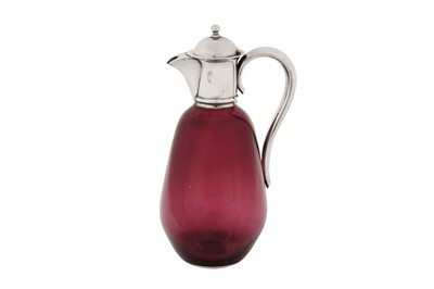 Lot 339 - A Victorian sterling silver mounted amethyst glass claret jug, London 1897 by Hukin and Heath