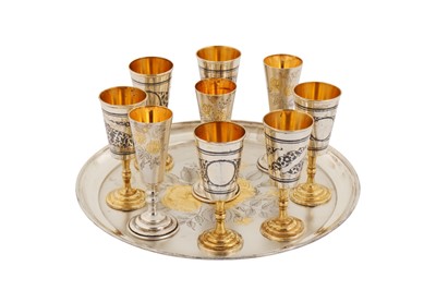 Lot 202 - A mid- 20th century Russian 875 standard parcel gilt silver vodka cup set, Moscow 1927-58