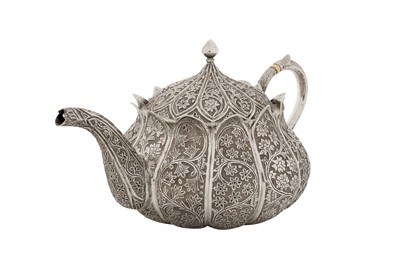 Lot 110 - A late 19th century Anglo – Indian unmarked silver teapot, Kashmir circa 1890