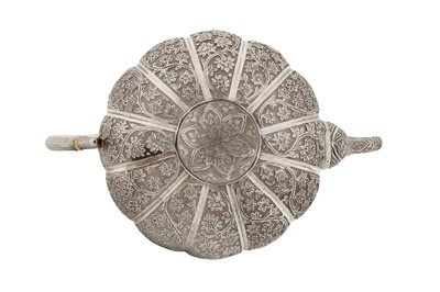 Lot 110 - A late 19th century Anglo – Indian unmarked silver teapot, Kashmir circa 1890