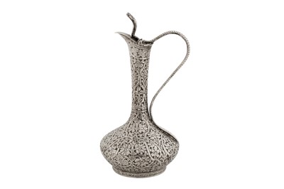 Lot 102 - A late 19th / early 20th century Anglo – Indian unmarked silver small ewer, Kashmir circa 1900