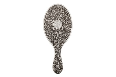 Lot 131 - A late 19th / early 20th century Anglo – Indian silver hand mirror, Madras circa 1900 by Peter Orr and Sons