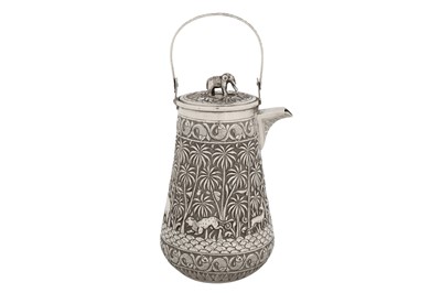 Lot 119 - A late 19th century Anglo – Indian unmarked silver hot water or coffee pot, Lucknow circa 1895