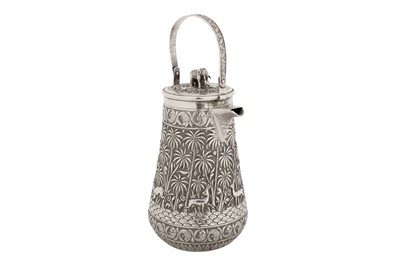 Lot 119 - A late 19th century Anglo – Indian unmarked silver hot water or coffee pot, Lucknow circa 1895