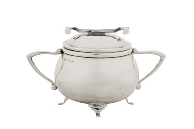 Lot 294 - A George V sterling silver SOS Pascall’s patent covered sugar bowl and tongs, Birmingham 1928 by W Coulthard Ltd