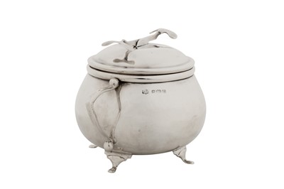 Lot 294 - A George V sterling silver SOS Pascall’s patent covered sugar bowl and tongs, Birmingham 1928 by W Coulthard Ltd