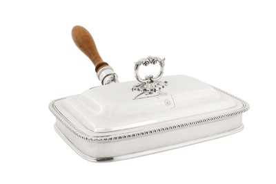 Lot 524 - A George III sterling silver toasted cheese dish, London 1812 by Thomas Robins