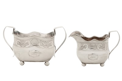 Lot 369 - A George IV Irish sterling silver milk jug and twin handled sugar bowl, Dublin 1820 by Richard Sawyer